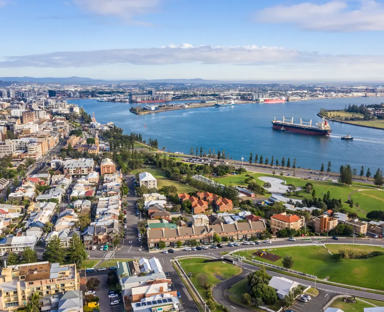 Aerial view of Newcastle harbour and the city — the Hunter Region we serve
